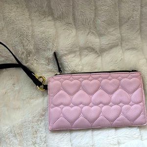 Cute Betsey Johnson clutch to take on a night out and can carry necessary items.